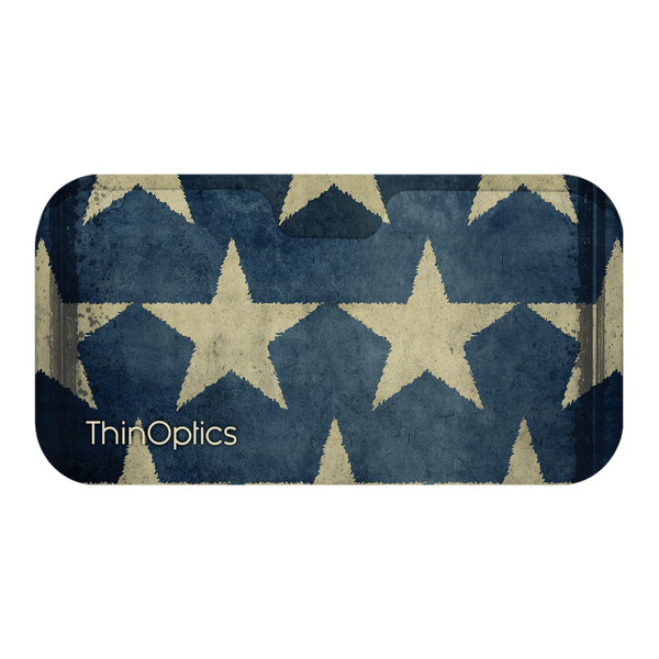 ThinOptics reading glasses case with a blue and tan vintage star pattern.