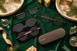 ThinOptics full frame Reading Glasses and Cases against a holiday themed laydown.