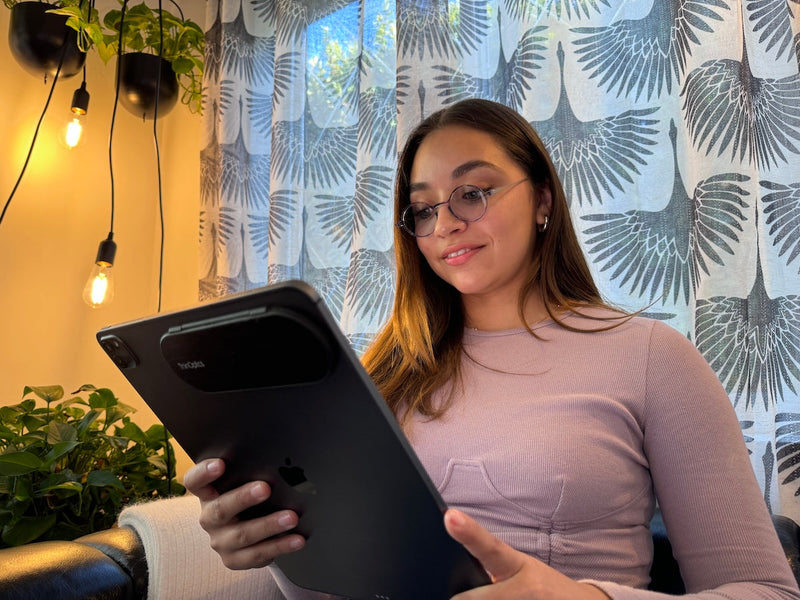 Woman wearing Manhattan Blue Light Blockers while using a tablet.
