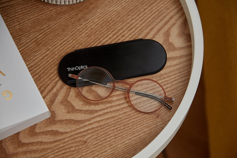 Manhattan Reading Glasses + Milano Case on a table.