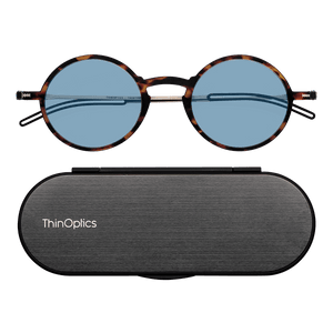 ThinOptics Tortoise framed Reading Glasses with Blue Light Blockers and a sleek black case: minimalist design with thin lenses. The compact, brushed metal case offers a modern, portable solution for individuals needing reading glasses.