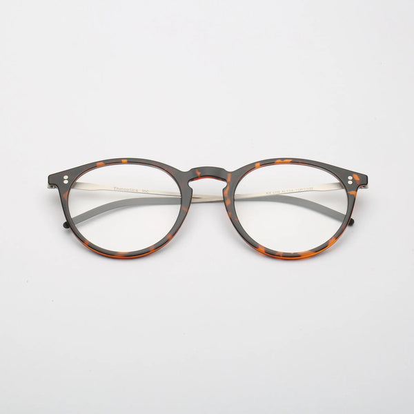 ThinOptics Los Altos tortoiseshell round prescription glasses with silver temples, front view laying flat on white background