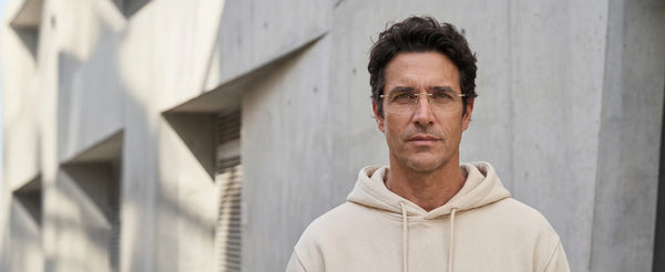 Man wearing prescription glasses outdoors