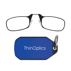 ThinOptics black armless reading glasses above a royal blue keychain case on a white background