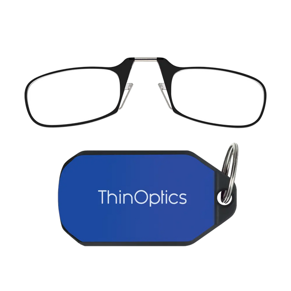ThinOptics black armless reading glasses above a royal blue keychain case on a white background