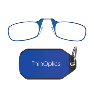 ThinOptics blue armless reading glasses above a royal blue keychain case on a white background
