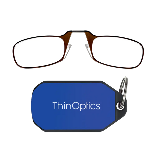 ThinOptics brown armless reading glasses above a royal blue keychain case on a white background