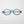 ThinOptics Manhattan Rx Glossy dark blue round prescription glasses folded flat, top-down view