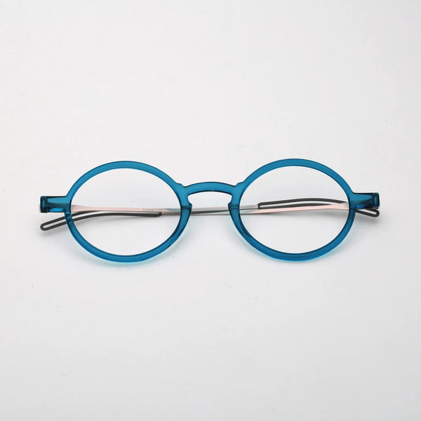 ThinOptics Manhattan Rx Glossy dark blue round prescription glasses folded flat, top-down view