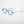 ThinOptics Manhattan Rx Glossy dark blue round prescription glasses at a three-quarter angle on white background