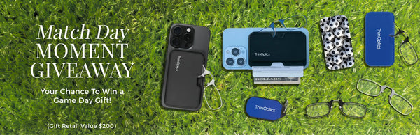 ThinOptics Match Day Moment Giveaway banner showing reading glasses, phone cases, and keychain cases arranged on a grass field