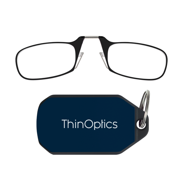 ThinOptics black armless reading glasses above a navy blue keychain case