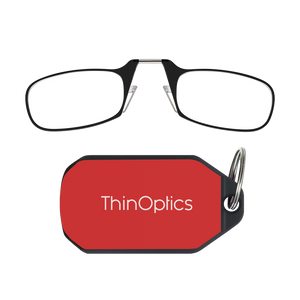 ThinOptics black armless reading glasses above a red keychain case
