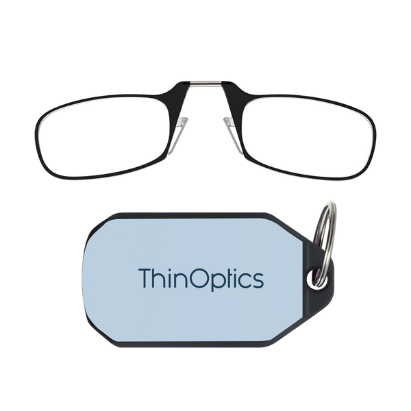 ThinOptics black armless reading glasses above a soft blue keychain case