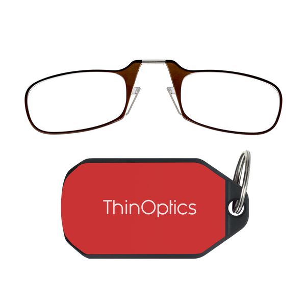 ThinOptics brown armless reading glasses above a red keychain case