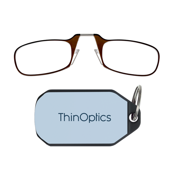 ThinOptics brown armless reading glasses above a soft blue keychain case