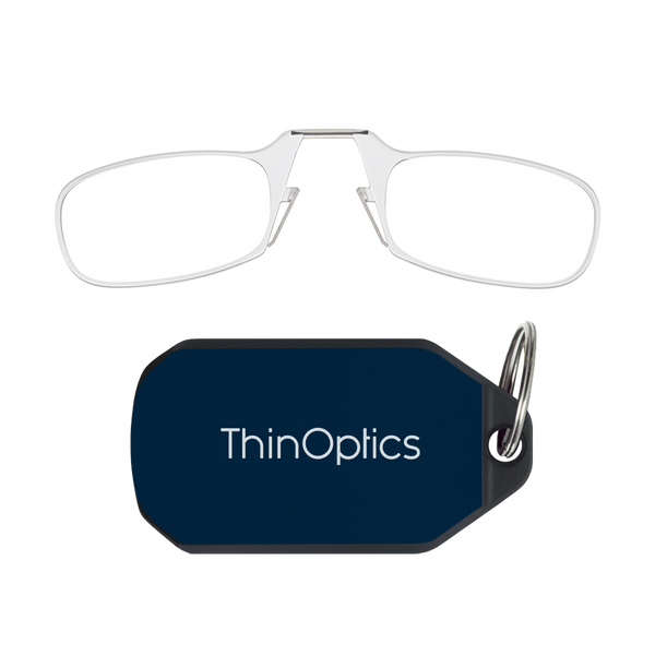 ThinOptics clear armless reading glasses above a navy blue keychain case