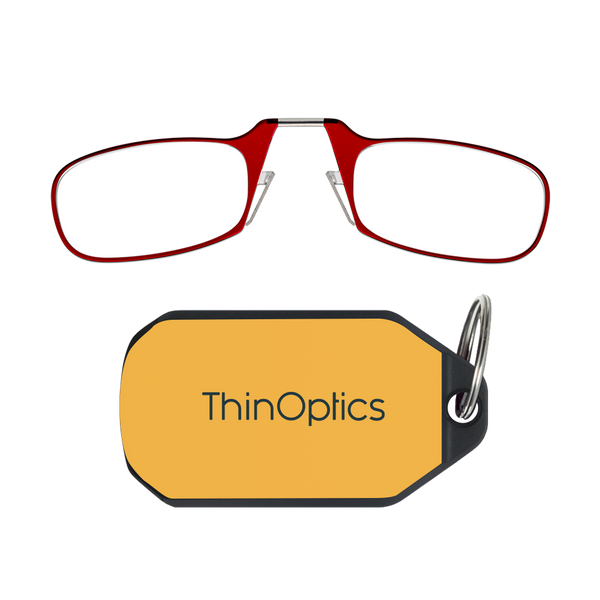ThinOptics red armless reading glasses above a yellow keychain case