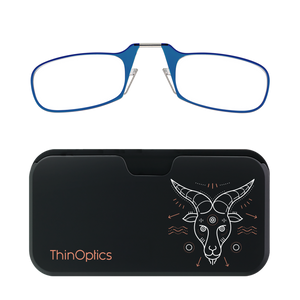 Blue ThinOptics reading glasses rest on a black carrying case decorated with a stylized white and copper goat head. 
